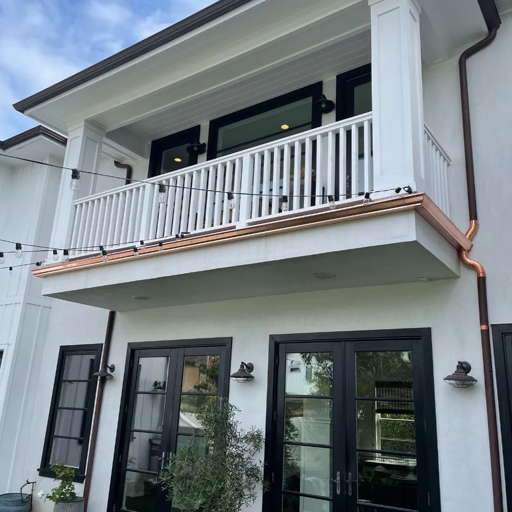 Copper gutters on a white house in Orange County, CA